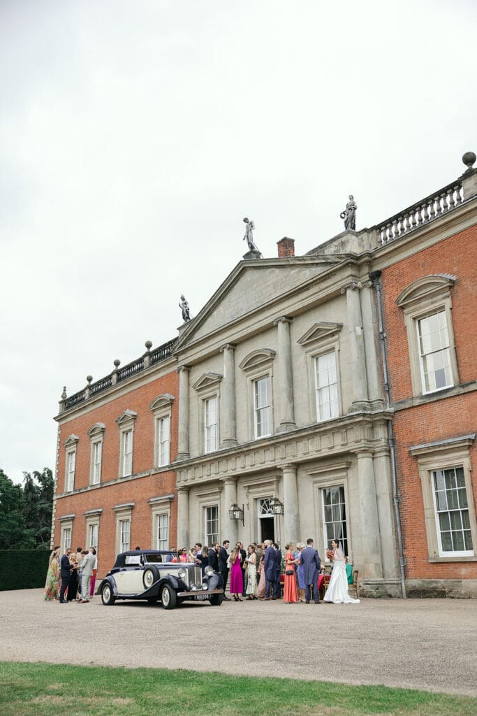 Guests gathered outside Staunton Harold Hall before the wedding reception