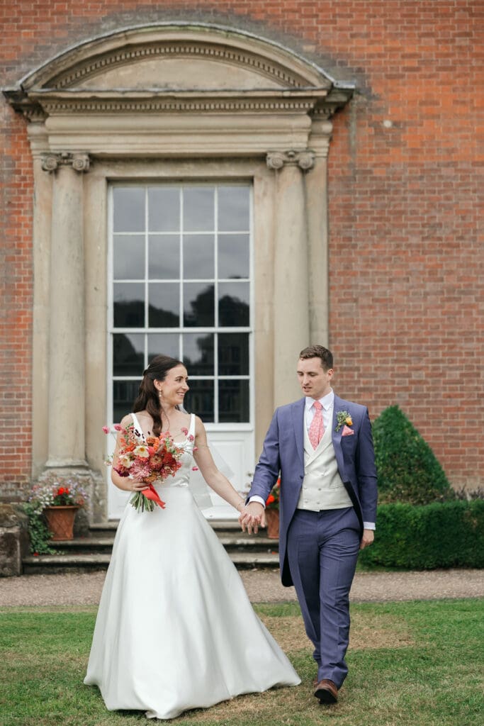 Wedding couple sharing a quiet moment in the parkland at Staunton Harold Hall