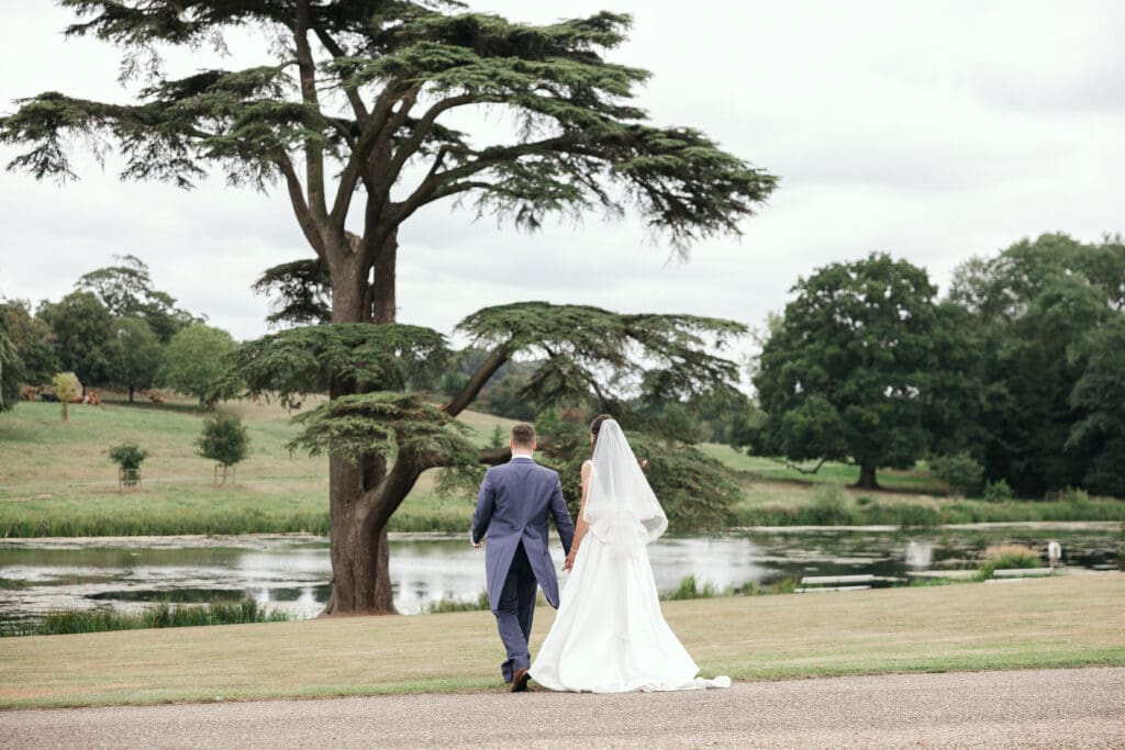 Wedding couple sharing a quiet moment in the parkland at Staunton Harold Hall