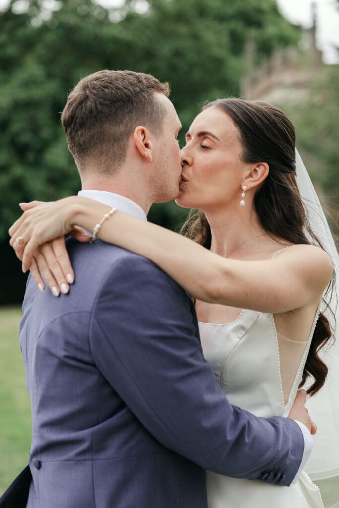 Wedding couple sharing a romsntic moment in the parkland at Staunton Harold Hall