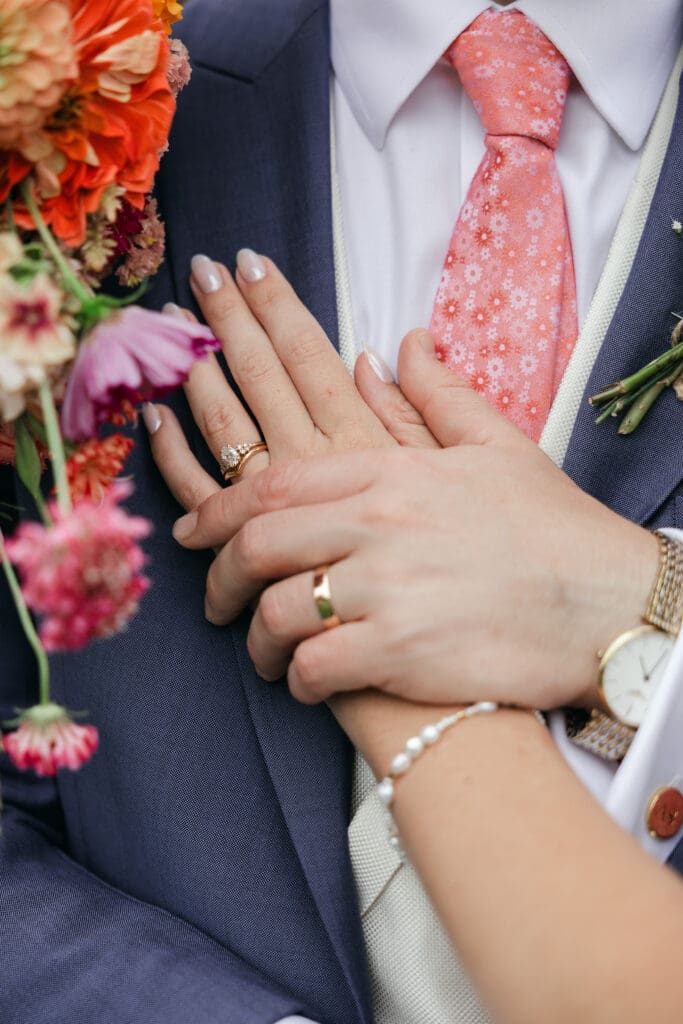 Hands close-up photo with wedding rings at Staunton Harold Hall wedding