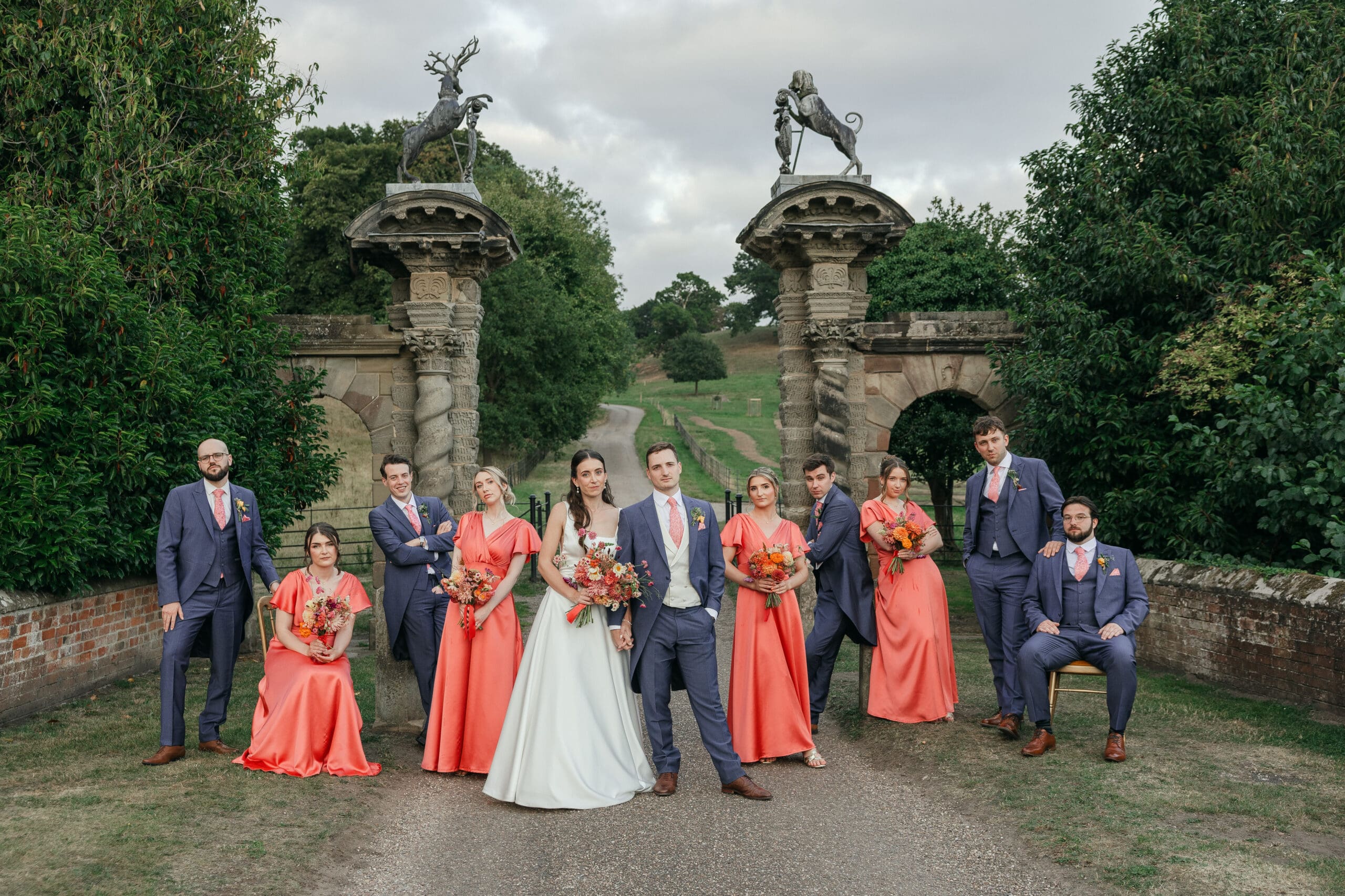 Bride and bridal party posing together,
Staunton Harold Hall wedding photographer Elise Kasak Photography