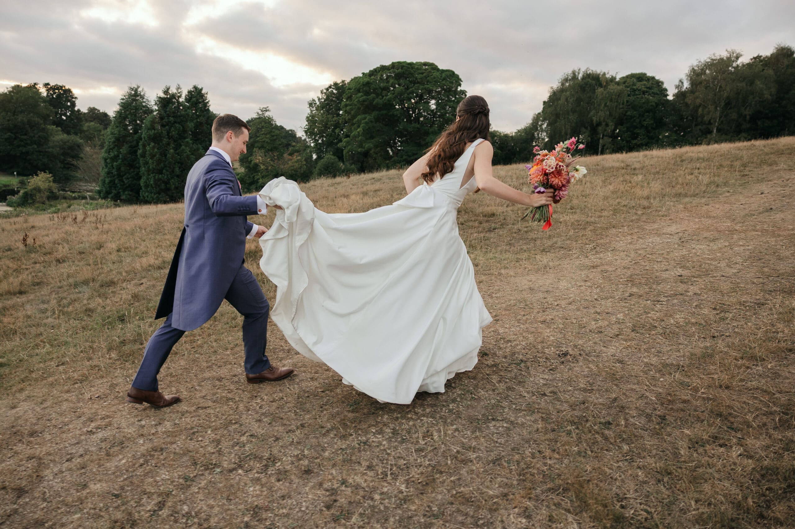Bride and Groom walking up the hill at Staunton Harold Hall wedding
Elise Kasak Photography