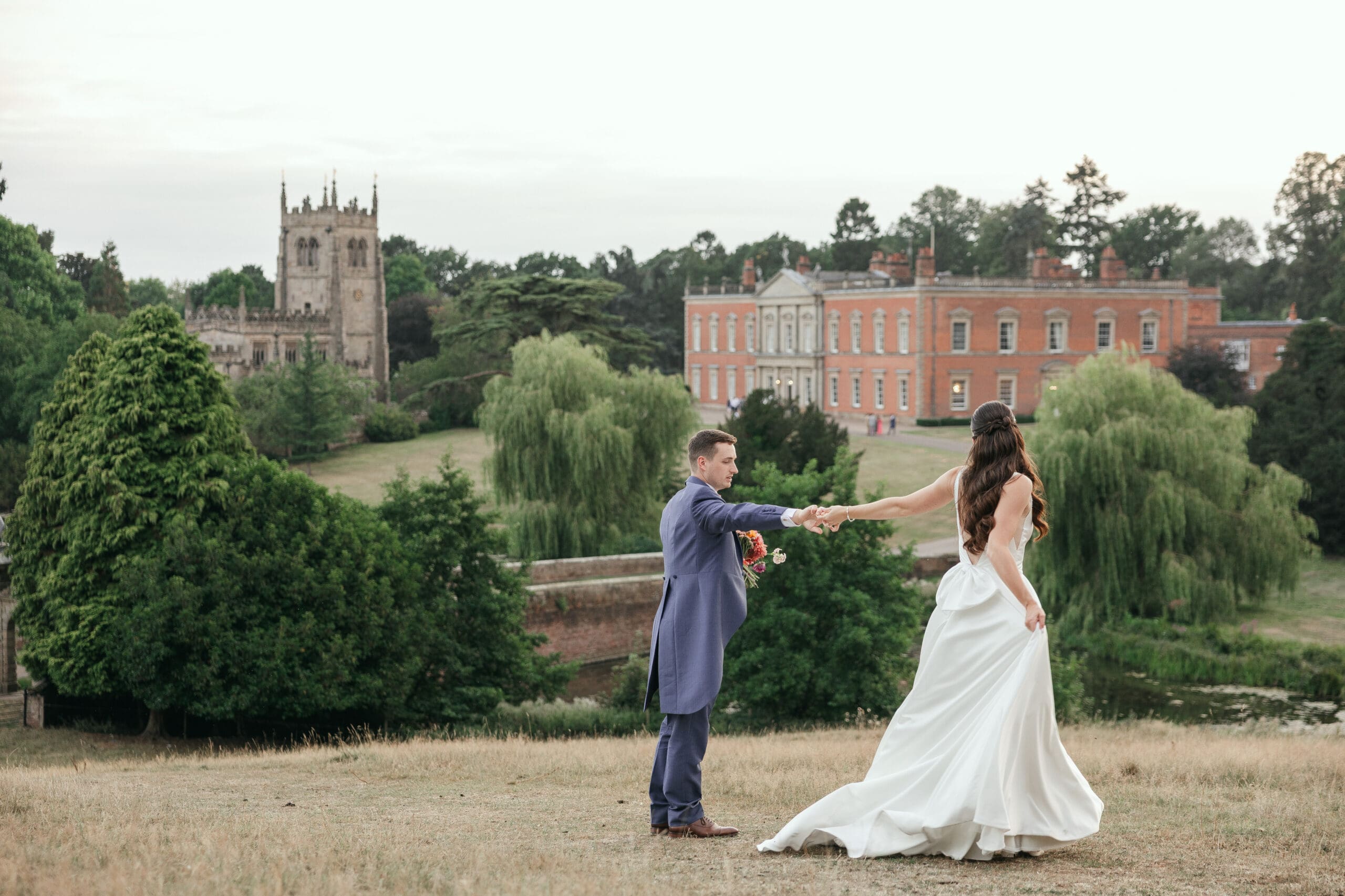 Wedding couple sharing a quiet moment in the parkland. Staunton Harold Hall wedding photographer