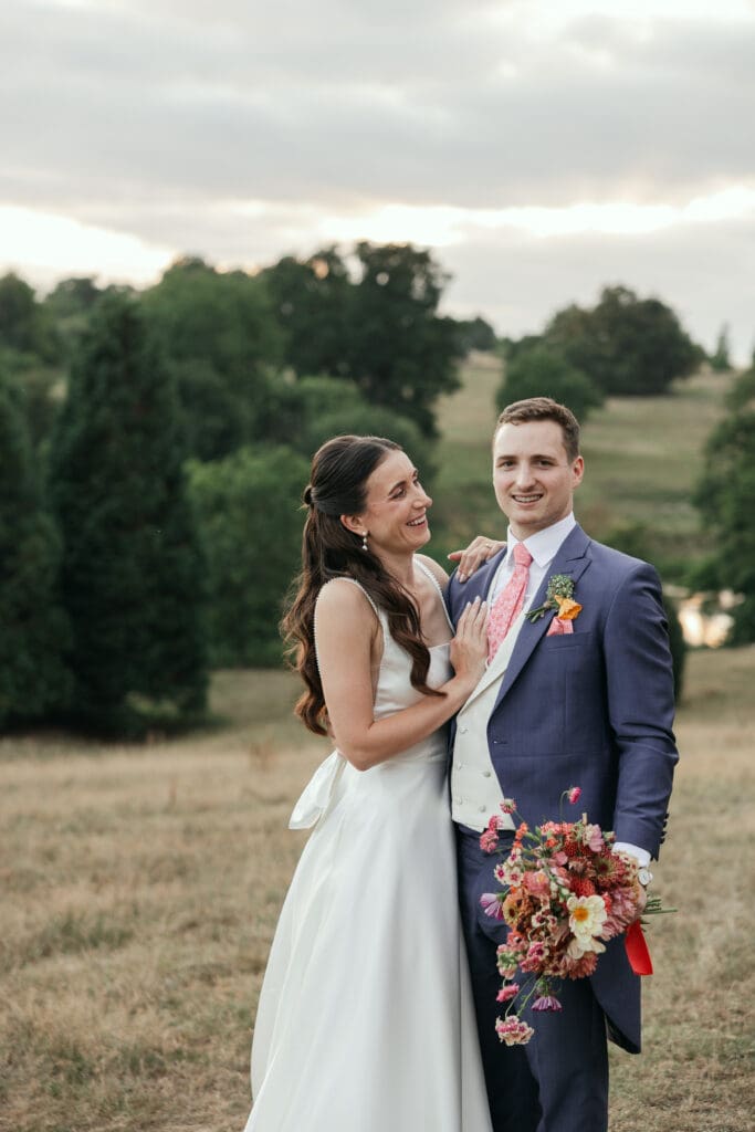 Wedding couple sharing a quiet moment in the parkland at Staunton Harold Hall