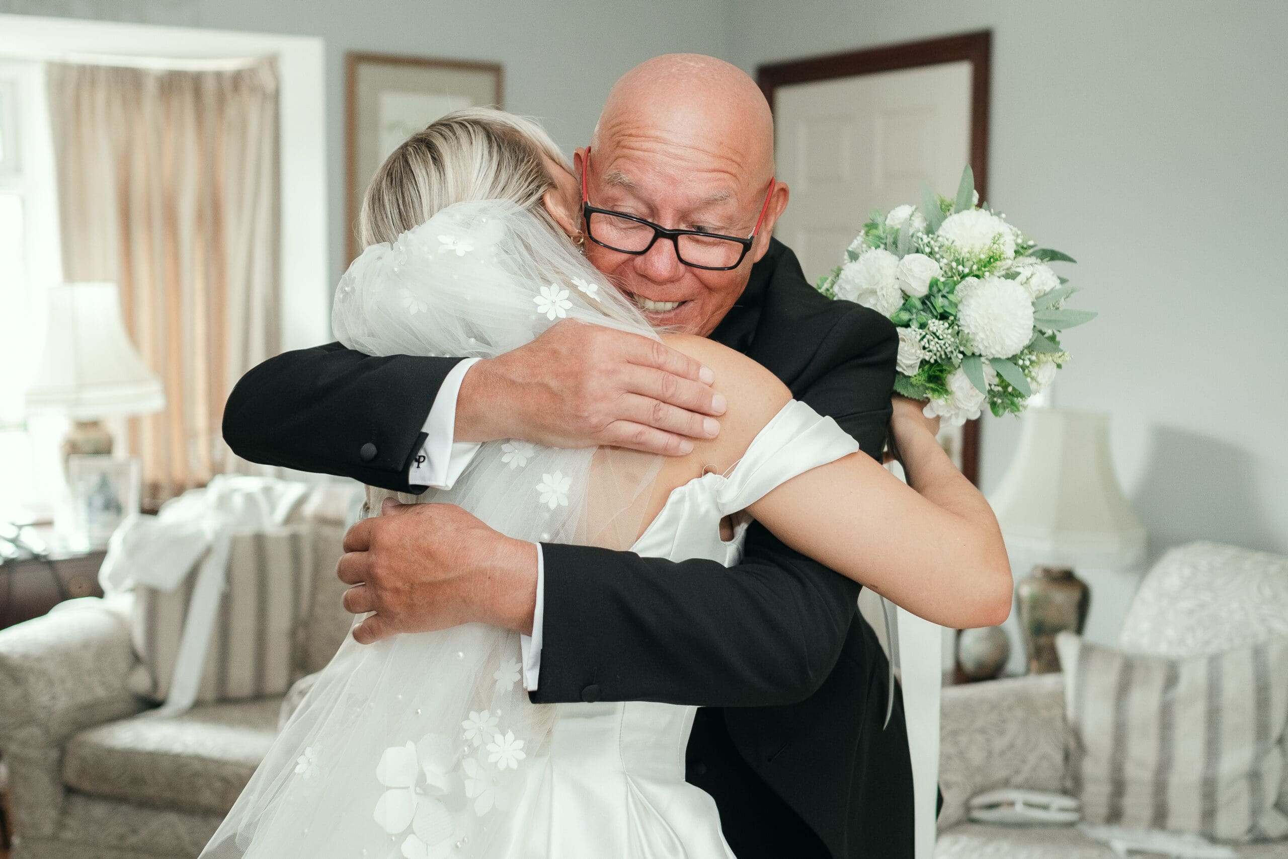 Emotional first look between the bride and her father on the wedding morning