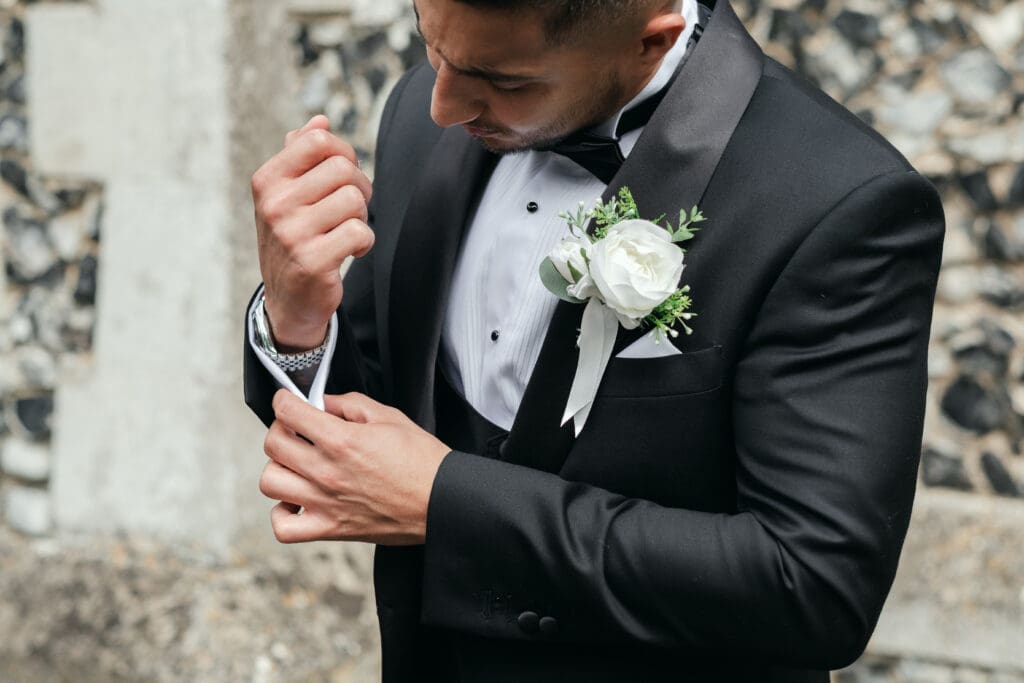 Groom adjusting his tie before the ceremony at St Paul’s Church Gorefield.