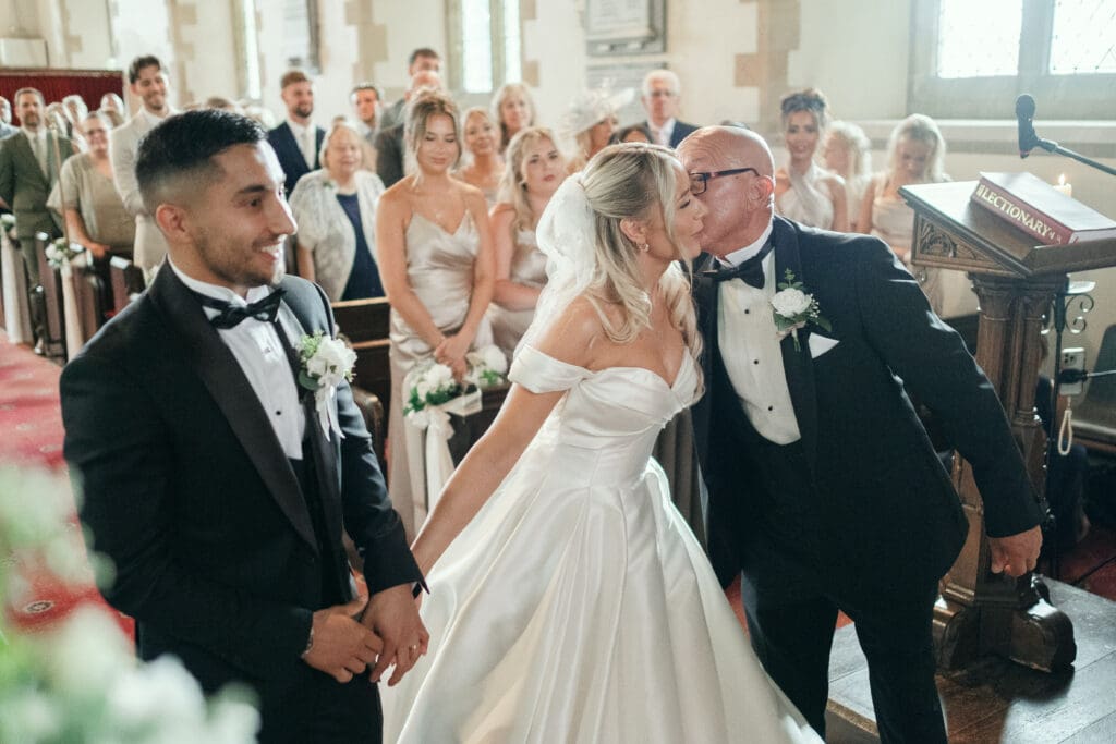 Bride and groom exchanging vows at St Paul’s Church on High Road, Gorefield