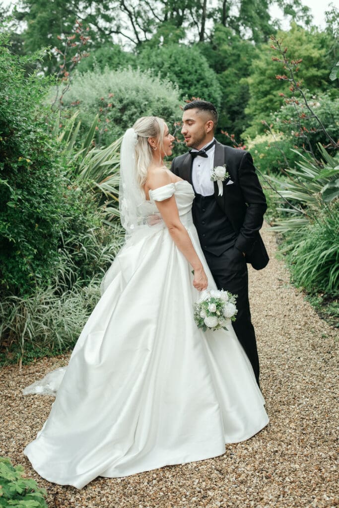 Bride and groom portraits in the lush gardens of The Hop Rooms in Wisbech