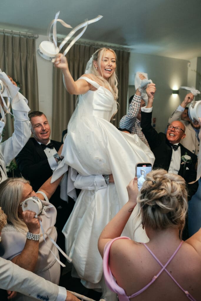 Guests dancing and celebrating during the wedding reception at The Hop Rooms
