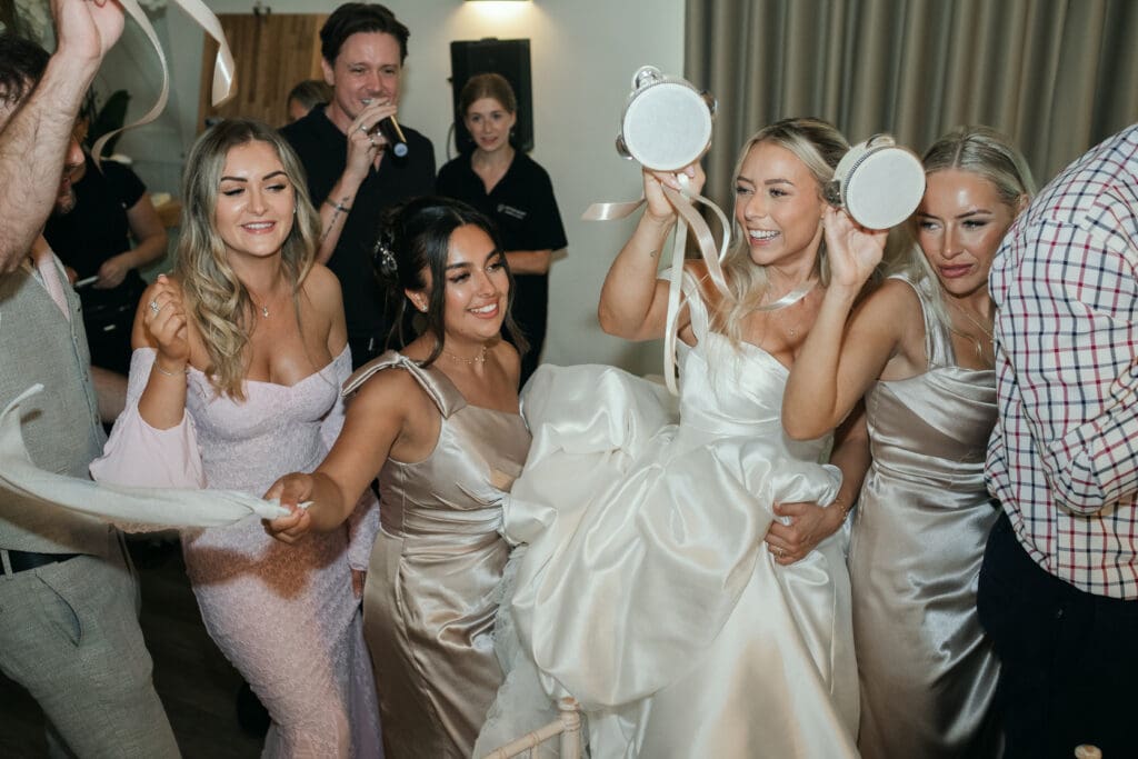 Guests dancing and celebrating during the wedding reception at The Hop Rooms