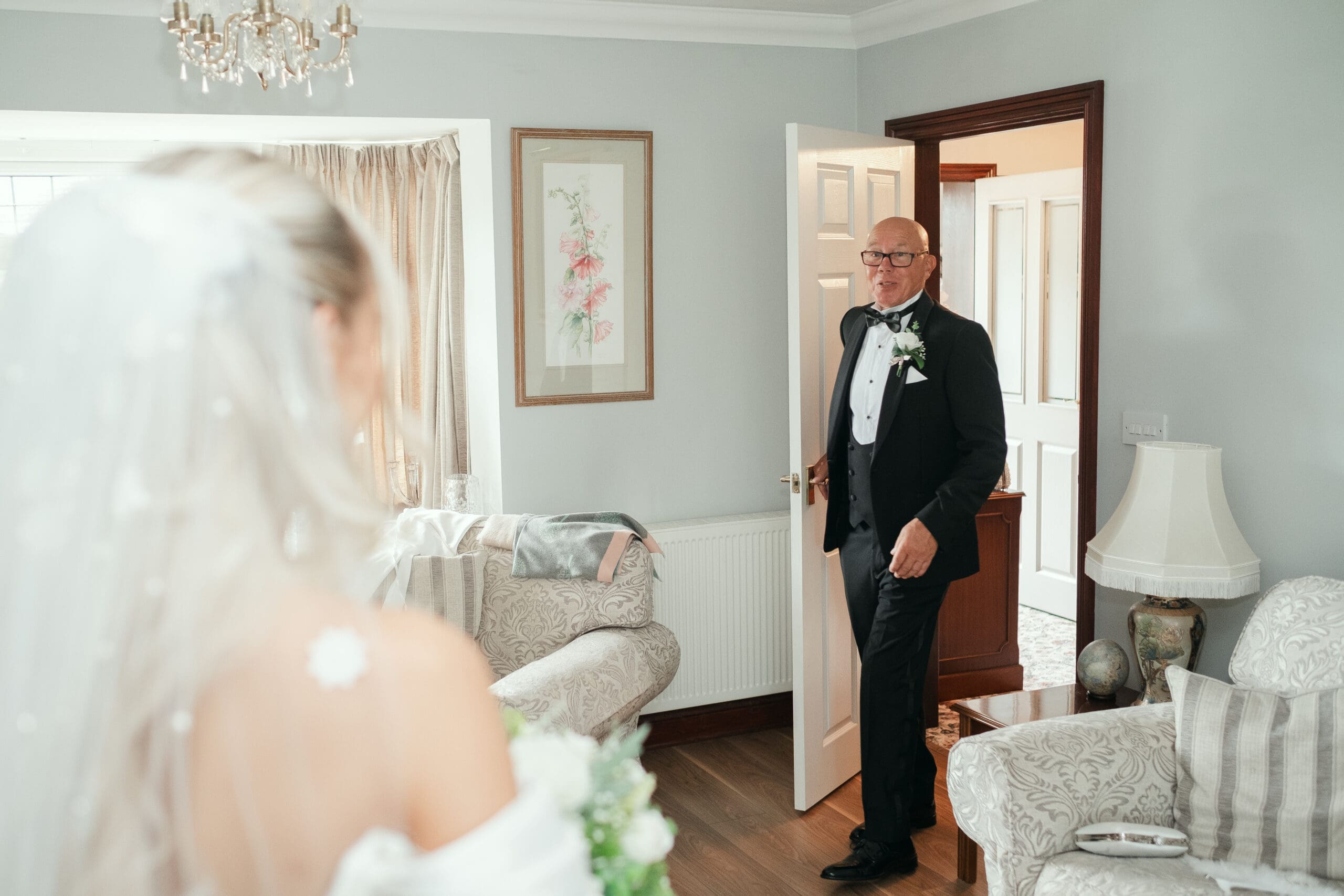 Emotional first look between the bride and her father on the wedding morning 